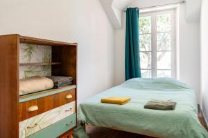 Postel nebo postele na pokoji v ubytování Le Pressoir du Château de Framboise