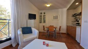 TV a/nebo společenská místnost v ubytování IMEDA Apartamentos MONTE GORBEA