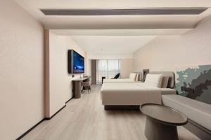 TV o dispositivi per l'intrattenimento presso Atour Light Hotel Xiamen Convention and Exhibition Center Software Park Phase II