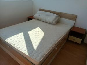 a bed in a room with a white mattress at Penthaus Cacao Beach in Sunny Beach +49 photos