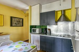 Kuchyňa alebo kuchynka v ubytovaní Apt Amarres, piscina comunitaria