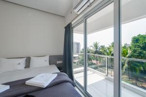 Postel nebo postele na pokoji v ubytování Manipal Atalia Service Apartments + 37 fotografií