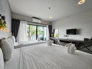 TV a/nebo společenská místnost v ubytování Little Loft Hotel