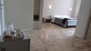 a room with a bedroom with a bed and a room with at B&B Monté in Montesilvano