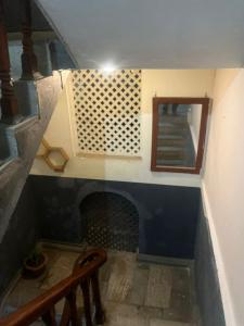 a room with a staircase with a fireplace and a mirror at Hotel Blue lake in Pokhara