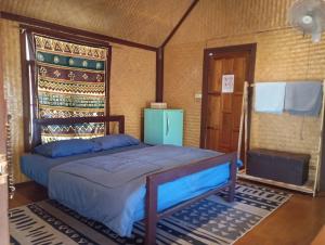 Postel nebo postele na pokoji v ubytování Kiniman Home