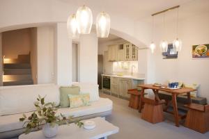 a living room with a couch and a table at Kea Mare LV Villas in Gialiskari