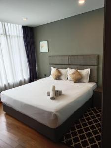 Postel nebo postele na pokoji v ubytování Vortex Suites KLCC By Farysha