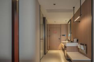 Phòng tắm tại 桔作酒店 许昌东站胖东来天使城店