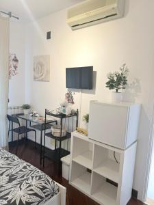 TV a/nebo společenská místnost v ubytování Leonardo Rome Holidays