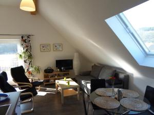 a living room with two tables and a couch at Werners Ferienwohnung in Insul