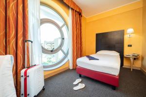 Letto o letti in una camera di Hotel Majorana