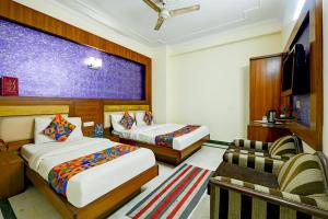 Postel nebo postele na pokoji v ubytování Hotel Paradise - New Delhi