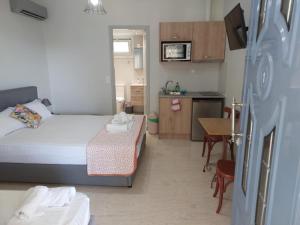 Ένα ή περισσότερα κρεβάτια σε δωμάτιο στο Mariannas House Nikiana