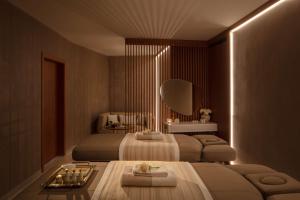 Кровать или кровати в номере Anantara Convento di Amalfi Grand Hotel