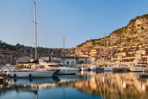 a bunch of boats are docked in a harbor at Tivoli Portopiccolo Sistiana Wellness Resort & Spa in Sistiana