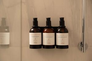 a group of three bottles of wine on a shelf at Tivoli Portopiccolo Sistiana Wellness Resort & Spa in Sistiana