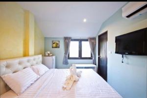 Ένα ή περισσότερα κρεβάτια σε δωμάτιο στο Theclickguesthouse