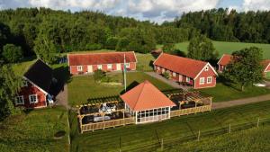 an overhead view of a farm with red roofs at Vindängs Gård Hagbards By in Slöinge