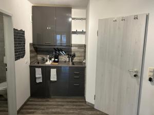 a small kitchen with a sink and a counter at Studio in the heart of Nürnberg in Nürnberg