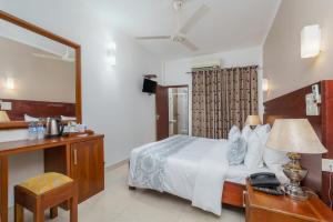 Letto o letti in una camera di Hotel Travellers Nest Kandy