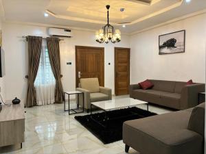 Posezení v ubytování Mainspring Home and Suite Ltd