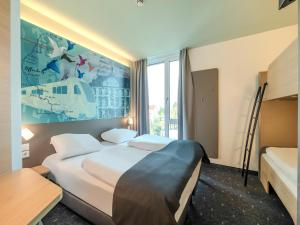 Postel nebo postele na pokoji v ubytování B&B HOTEL Offenburg-Hbf