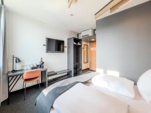 Postel nebo postele na pokoji v ubytování B&B HOTEL Offenburg-Hbf