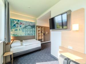 Postel nebo postele na pokoji v ubytování B&B HOTEL Offenburg-Hbf