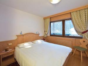 Postel nebo postele na pokoji v ubytování Residence Salvan
