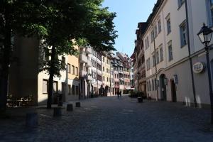 a cobblestone street in a city with buildings at Studio in the heart of Nürnberg in Nürnberg