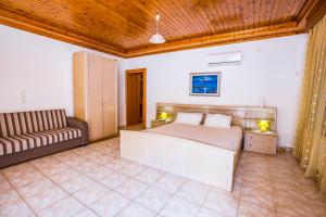 A bed or beds in a room at Villa Aleka