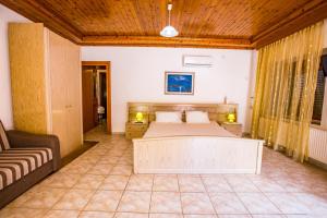 A bed or beds in a room at Villa Aleka