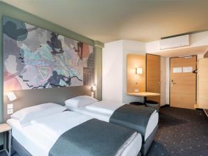 Postel nebo postele na pokoji v ubytování B&B HOTEL Wien-St-Marx + 24 fotografií