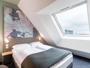 Postel nebo postele na pokoji v ubytování B&B HOTEL Wien-St-Marx
