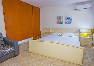 A bed or beds in a room at Villa Aleka