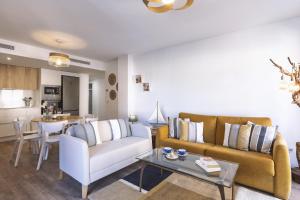 a living room with a couch and a table at Nova Essential in Jávea