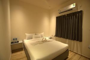 Postel nebo postele na pokoji v ubytování Lazo Avarta Resort and Convention Centre Pondicherry