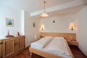 Postel nebo postele na pokoji v ubytování Residence Salvan