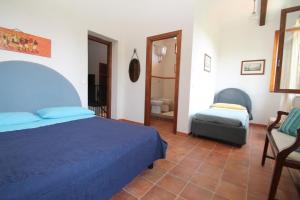 Łóżko lub łóżka w pokoju w obiekcie Villa Tresino B&B