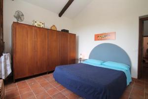 Łóżko lub łóżka w pokoju w obiekcie Villa Tresino B&B