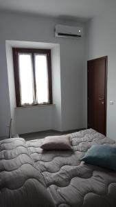 Postel nebo postele na pokoji v ubytování Podere Monfalcone guest house