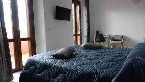 Postel nebo postele na pokoji v ubytování Podere Monfalcone guest house
