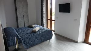 Postel nebo postele na pokoji v ubytování Podere Monfalcone guest house