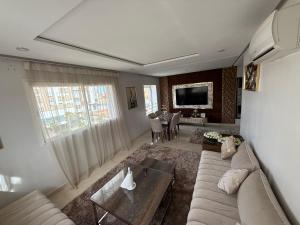 Posezení v ubytování Superbe appartement avec Netflix et Iptv