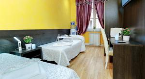 Postel nebo postele na pokoji v ubytování Termini Suites + 12 fotografií