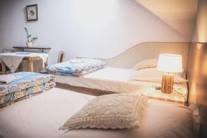 Łóżko lub łóżka w pokoju w obiekcie Agroturystyka Oświęcim