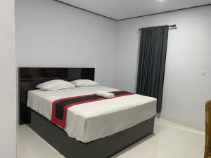 Postel nebo postele na pokoji v ubytování Taman Ratih Guest House + 22 fotografií