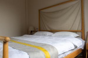 Postel nebo postele na pokoji v ubytování Zhangjiajie Chunshanzhu Bed and Breakfast