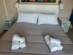 Letto o letti in una camera di 4Rooms Guest House Free Wi-Fi
